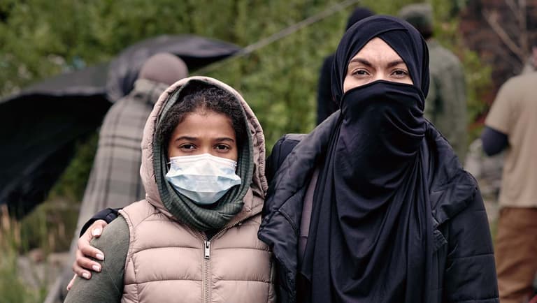 a couple wearing masks